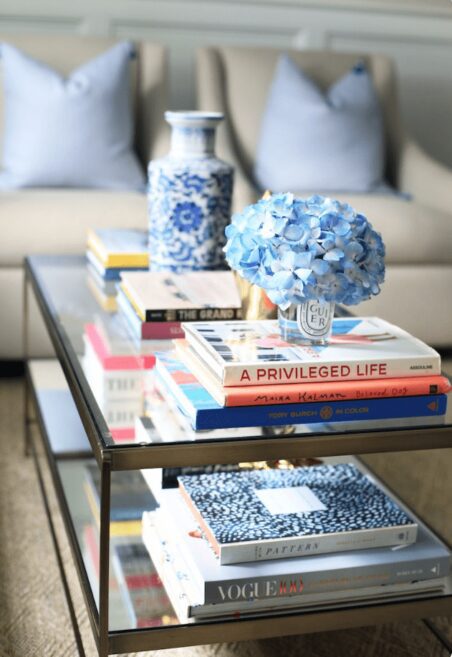 Books on glass coffee table